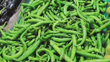 Pile of Green Peppers on the Market Counter video