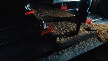 Close-up of a CNC router machine carving wood, wood chips flying, carpentry workshop, technology in woodworking ,and craftsmanship. video