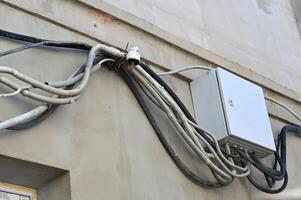 a wall with many wires attached to it photo