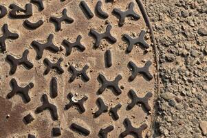 a manhole cover with a bunch of numbers on it photo