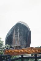 The mountain peak of Khao Khitchakut, to pay respects to the footprint of the Buddha and gigantic stone. photo