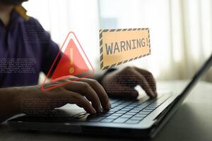 System hacked warning alert on notebook. Cyber attack on computer network. Compromised information internet. photo