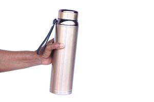 Hand hold portable stainless steel water vacuum bottle, isolated on white background. Concept, reusable water bottle for keeping temperature of cool or warm water. Drinking water container. photo