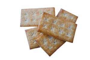 Crispy biscuits crackers on white background. Concept, bake bakery. Snack sweet food with high calorie and carbohydrate but delicious to eat with coffee or other beverages. photo
