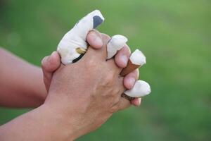 Hand muscle exercises for paralyzed patient by squeezing soft objects stuffed with sponges that fit with fingers locking. Concept, Healthcare for physical therapy to strengthen or recovery weak muscle photo