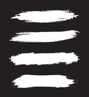 A set of four white paint strokes on a black background vector