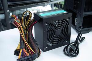 Side view of computer power supply, computer components, motherboard and electrical circuits. photo