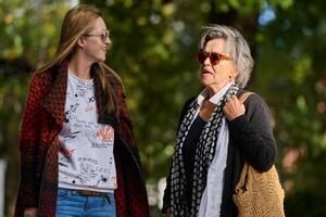 Autumn Walk. A Mother and Daughter Share Love and Support in Natures Embrace. photo