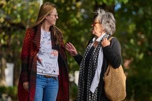 Autumn Walk. A Mother and Daughter Share Love and Support in Natures Embrace. photo