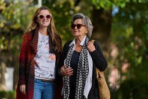 Autumn Walk. A Mother and Daughter Share Love and Support in Natures Embrace. photo