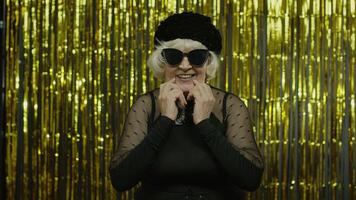 Senior old woman with happy meditative expression, fantasizing, thinking, making positive idea video