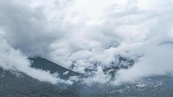Clouds and fog move between the mountains video