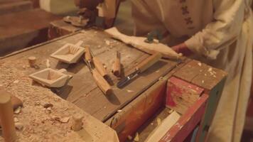 Craftswoman prepares equipment for making wooden figures video