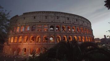 Large Colosseum illuminated with lights at twilight in Rome video