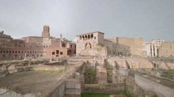 Trajan Forum with ancient ruins and buildings on sunny day video
