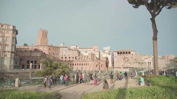 Tourists visit Trajan Forum with ancient ruins in Rome video