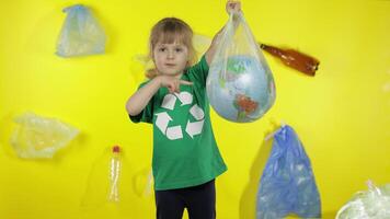Girl activist with Earth globe in plastic package. Reduce nature pollution. Save ecology environment video