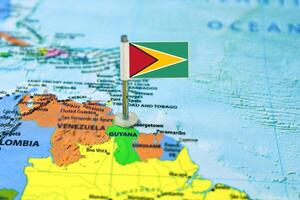 Guyana flag on the map with selective focus and shallow DOF photo