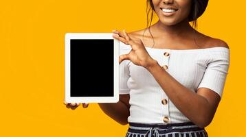 Great Application. Unrecognizable Girl Showing Tablet Computer Empty Screen Standing On Orange Background. Cropped, Panorama, Mockup photo