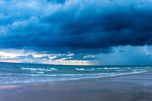 Beach with beautiful rain clouds photo