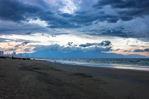 Beach with beautiful rain clouds photo