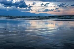 Beach with beautiful rain clouds photo