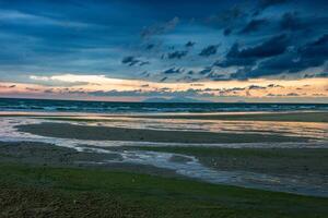 Beach with beautiful rain clouds photo