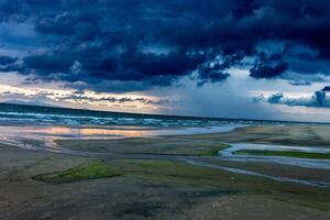 Beach with beautiful rain clouds photo