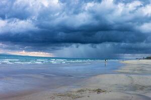 Beach with beautiful rain clouds photo