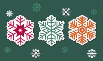 set of three flat simple christmas green, red, orange snowflakes on green background. group of winter elements vector