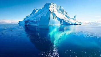 A large iceberg floating in the middle of the ocean video