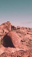 A rock formation in the middle of a desert video