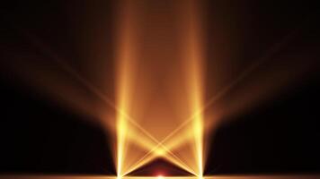 A spotlight illuminates the background of the stage. Spotlights of bright light. Rays of golden color. Empty stage with light for product. Seamless looping 4k video