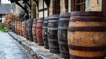 A row of wooden barrels lined up on the side of a building video