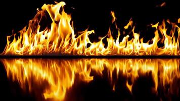 A fire is reflected in the water on a black background video