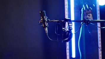 Modern recording microphone on stage in the studio used to create rock or pop music, live creative performance before a concert. Empty space with electronics for live music and production. video
