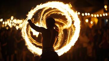 A man with fire in his hands at night photo