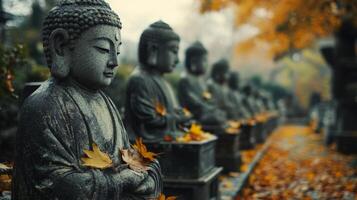 Stone Buddha Statues in Autumn Foliage photo