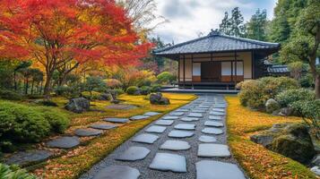 Stone Pathway Leading to a Traditional Japanese House in an Autumnal Garden photo