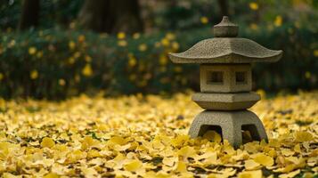 Stone Lantern Amidst a Blanket of Golden Ginkgo Leaves photo