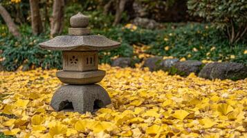 Stone Lantern Surrounded by Golden Ginkgo Leaves in a Japanese Garden photo