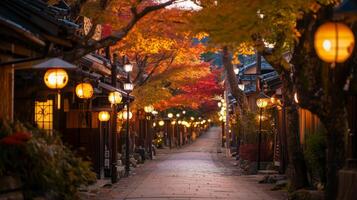 Illuminated Street Lined with Traditional Japanese Buildings and Autumn Trees photo