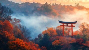 Red Torii Gate Amidst Foggy Autumn Forest photo