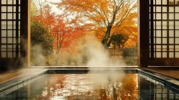 A Steamy Onsen Bath with Autumnal Trees Outside a Japanese Window photo