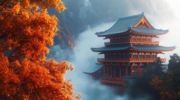 Red-Leafed Tree and Foggy Pagoda in a Mountainous Setting photo