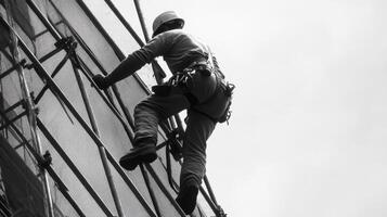 A Construction Worker Ascending Scaffolding photo