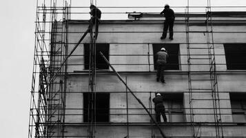 Workers on Scaffolding During Building Construction photo