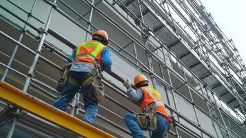 Construction Workers on Scaffolding During Building Renovation photo