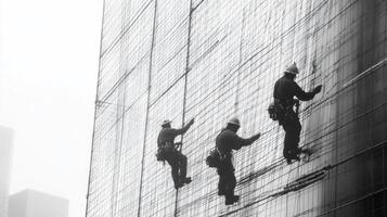 Two Construction Workers on a Scaffolding-Covered Building photo