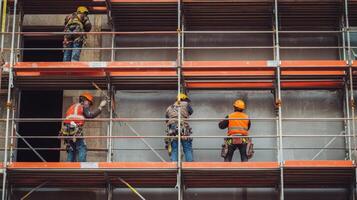 Construction Workers on Scaffolding During Building Renovation photo
